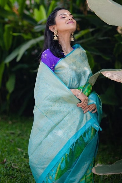 Aqua Banarasi Soft Silk Saree with Green Patola-Style Geometric Weave and Silver Zari Border in Surat