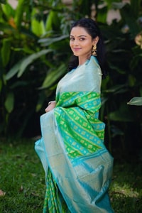 Aqua Banarasi Soft Silk Saree with Green Patola-Style Geometric Weave and Silver Zari Border  in Surat