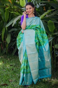 Aqua Banarasi Soft Silk Saree with Green Patola-Style Geometric Weave and Silver Zari Border  in Surat