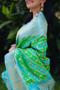 Aqua Banarasi Soft Silk Saree with Green Patola-Style Geometric Weave and Silver Zari Border  in Surat