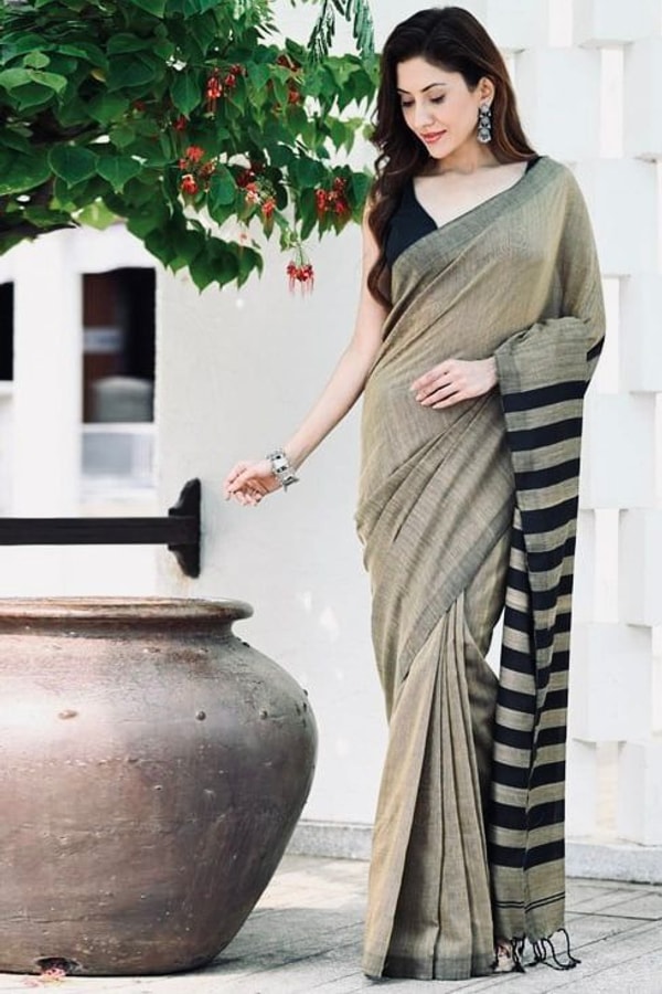 Beige and Black Saree with Bold Black Striped Pallu, Contrast Border and Tassels  in Surat