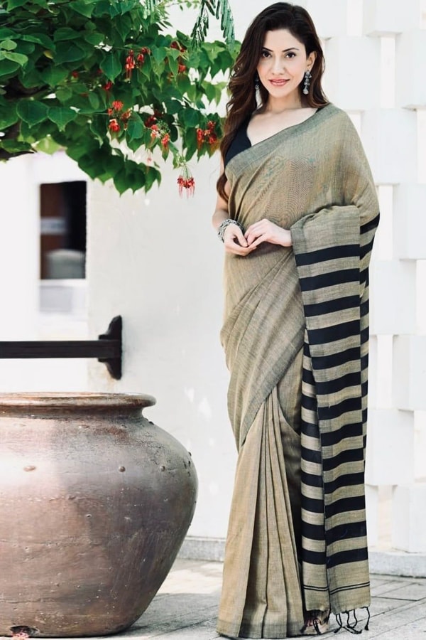 Beige and Black Saree with Bold Black Striped Pallu, Contrast Border and Tassels  in Surat
