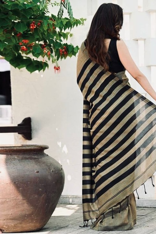 Beige and Black Saree with Bold Black Striped Pallu, Contrast Border and Tassels  in Surat