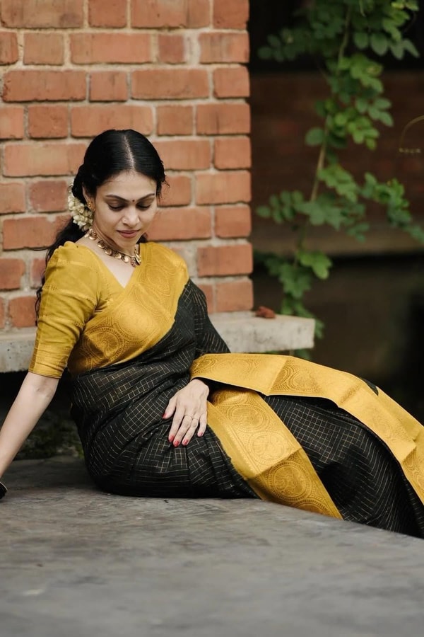 Black Banarasi Soft Silk Saree with Broad Mustard Yellow Border and Gold Zari Pallu  in Surat
