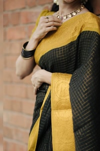 Black Banarasi Soft Silk Saree with Broad Mustard Yellow Border and Gold Zari Pallu  in Surat
