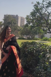 Black Banarasi Soft Silk Saree with Large Gold Floral Buttas and Burnt Orange Zari Border  in Surat video 1