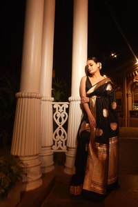 Black Banarasi Soft Silk Saree with Large Gold Zari Floral Buttas and Striped Gold Border  in Surat