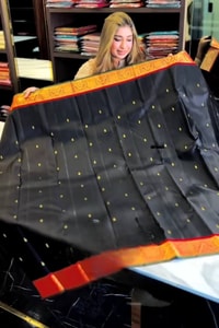 Black Banarasi Soft Silk Saree with Polka Zari Dots, Orange Border and Red Contrast Pallu  in Surat