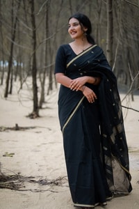Black Saree with Gold Zari Buttis, Thin Gold Border and Tasselled Zari Pallu  in Surat