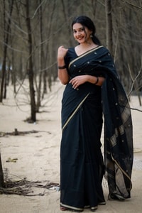 Black Saree with Gold Zari Buttis, Thin Gold Border and Tasselled Zari Pallu  in Surat