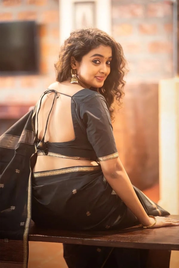 Black Saree with Gold Zari Buttis, Thin Gold Border and Tasselled Zari Pallu  in Surat
