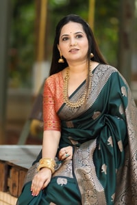 Bottle Green Banarasi Soft Silk Saree with Antique Silver Zari Buttas and Rich Woven Pallu  in Surat