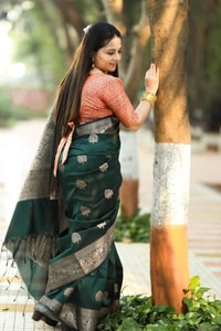 Bottle Green Banarasi Soft Silk Saree with Antique Silver Zari Buttas and Rich Woven Pallu  in Surat