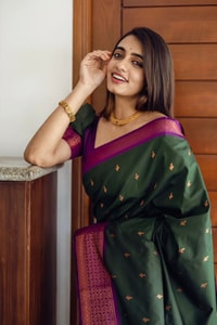 Bottle Green Banarasi Soft Silk Saree with Copper Zari Buttis and Contrast Purple Pallu  in Surat