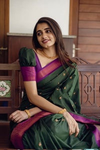 Bottle Green Banarasi Soft Silk Saree with Copper Zari Buttis and Contrast Purple Pallu  in Surat