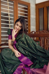 Bottle Green Banarasi Soft Silk Saree with Copper Zari Buttis and Contrast Purple Pallu  in Surat