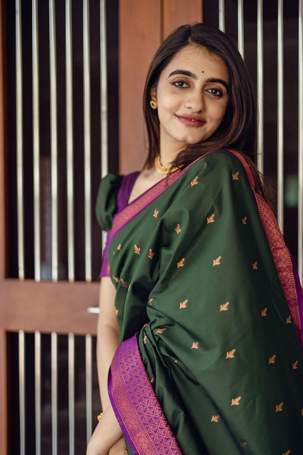 Bottle Green Banarasi Soft Silk Saree with Copper Zari Buttis and Contrast Purple Pallu  in Surat