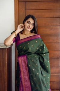 Bottle Green Banarasi Soft Silk Saree with Copper Zari Buttis and Contrast Purple Pallu  in Surat