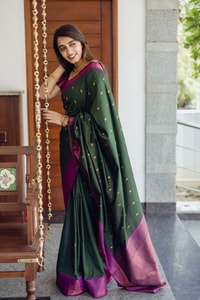 Bottle Green Banarasi Soft Silk Saree with Copper Zari Buttis and Contrast Purple Pallu  in Surat