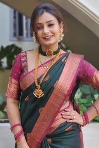Bottle Green Banarasi Soft Silk Saree with Pink Contrast Border and Copper Zari Butis  in Surat