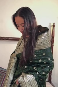 Bottle Green Banarasi Soft Silk Saree with Silver Zari Floral Buttis and Ornate Woven Pallu  in Surat