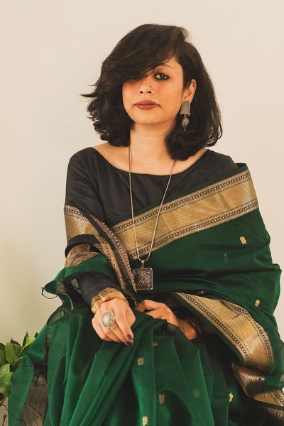 Bottle Green Saree with Contrast Black Zari Pallu, Gold Border and Tassels in Surat