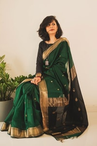 Bottle Green Saree with Contrast Black Zari Pallu, Gold Border and Tassels  in Surat