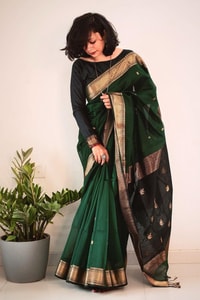 Bottle Green Saree with Contrast Black Zari Pallu, Gold Border and Tassels  in Surat