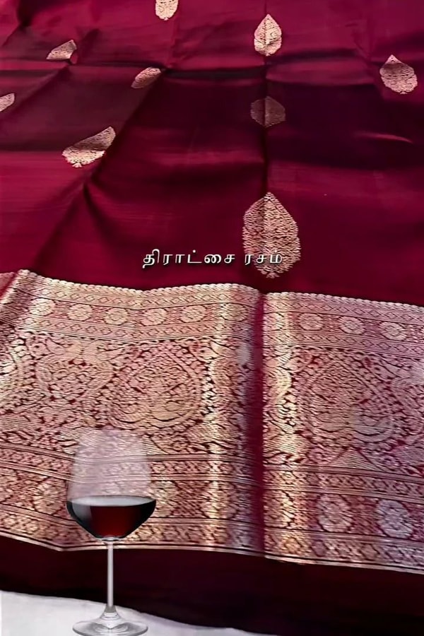Burgundy Banarasi Soft Silk Saree with Pale Zari Leaf Buttas and Wide Brocade Pallu  in Surat