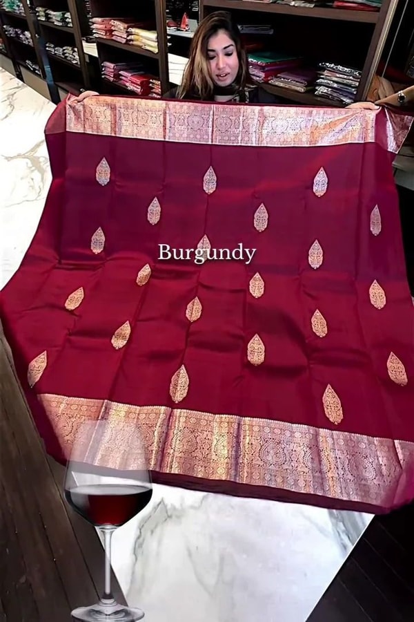 Burgundy Banarasi Soft Silk Saree with Pale Zari Leaf Buttas and Wide Brocade Pallu  in Surat