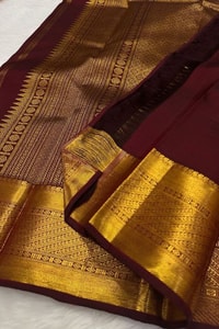 Chocolate Maroon Banarasi Soft Silk Saree with All-Over Gold Leaf Buttas and Zari Pallu  in Surat