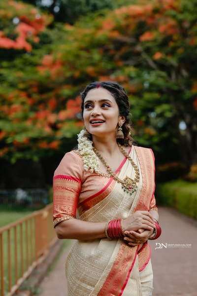 Cream Banarasi Soft Silk Saree with Coral Red Border and Kerala Style Contrast Pallu in Surat