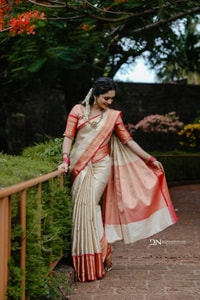 Cream Banarasi Soft Silk Saree with Coral Red Border and Kerala Style Contrast Pallu  in Surat