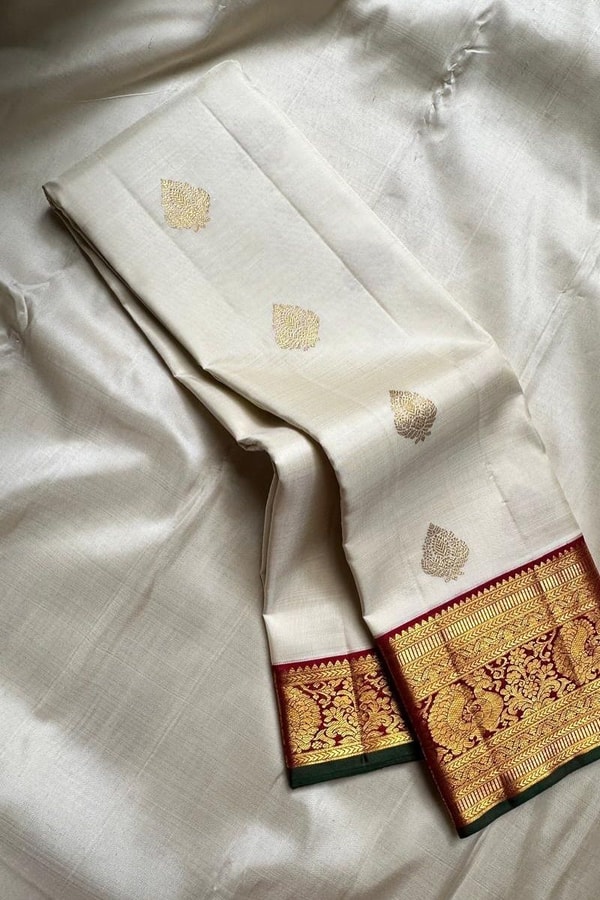 Cream Banarasi Soft Silk Saree with Gold Leaf Buttas and Maroon Zari Border and Pallu  in Surat
