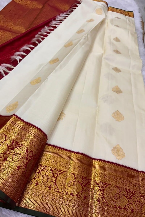Cream Banarasi Soft Silk Saree with Gold Leaf Buttas and Maroon Zari Border and Pallu  in Surat