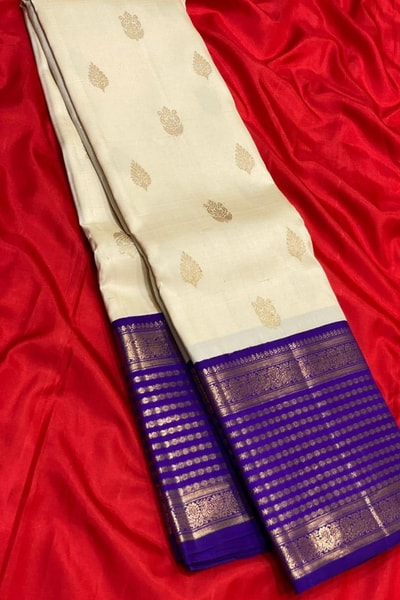 Cream Banarasi Soft Silk Saree with Gold Leaf Buttas and Wide Violet Zari Striped Border in Surat