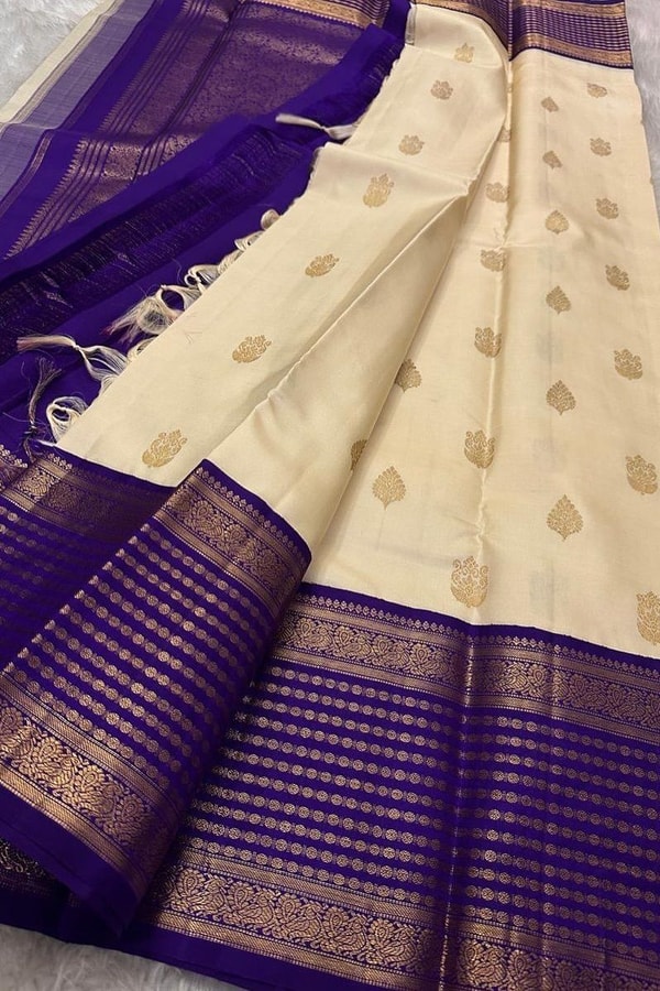 Cream Banarasi Soft Silk Saree with Gold Leaf Buttas and Wide Violet Zari Striped Border  in Surat