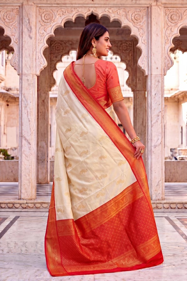 Cream Banarasi Soft Silk Saree with Gold Zari Buttas and Contrast Maroon Zari Border  in Surat
