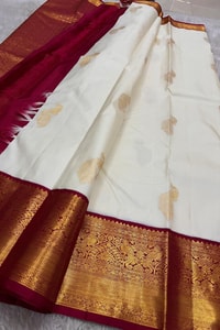 Cream Banarasi Soft Silk Saree with Gold Zari Buttas and Contrast Maroon Zari Border  in Surat