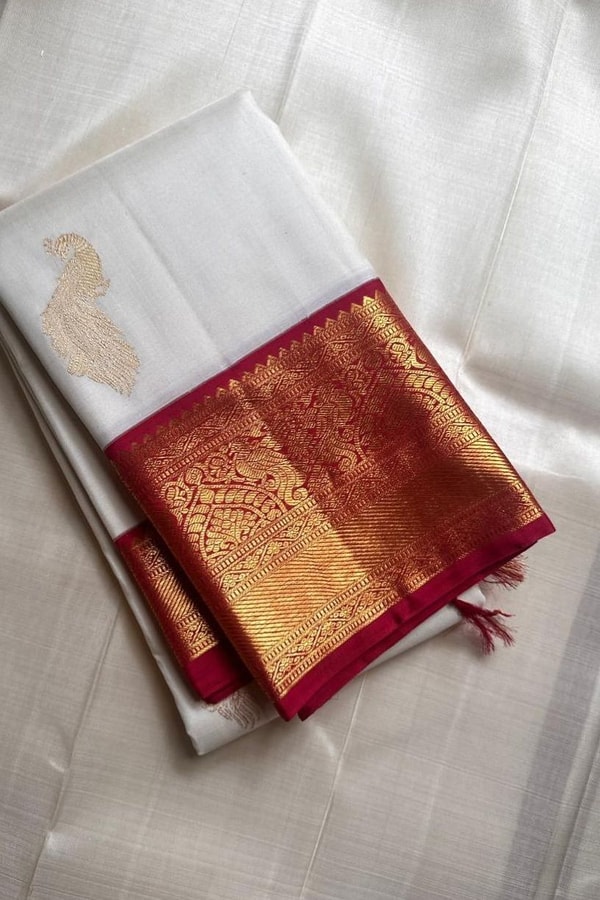Cream Banarasi Soft Silk Saree with Gold Zari Buttas and Contrast Maroon Zari Border  in Surat