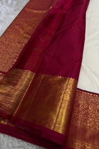 Cream Banarasi Soft Silk Saree with Gold Zari Buttas and Contrast Maroon Zari Border  in Surat