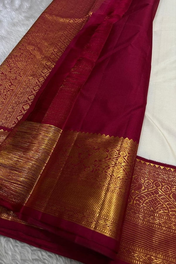 Cream Banarasi Soft Silk Saree with Gold Zari Buttas and Contrast Maroon Zari Border  in Surat