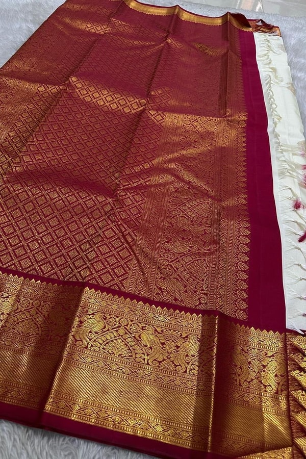 Cream Banarasi Soft Silk Saree with Gold Zari Buttas and Contrast Maroon Zari Border  in Surat
