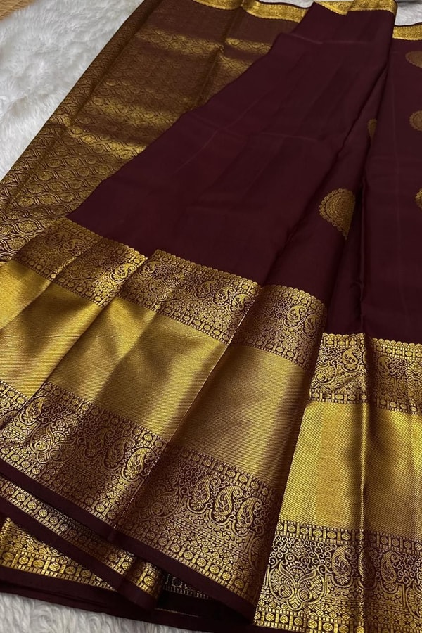 Dark Maroon Banarasi Soft Silk Saree with Sparse Zari Chakra Buttas and Grand Gold Border  in Surat