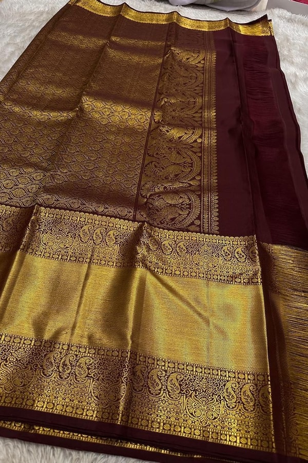 Dark Maroon Banarasi Soft Silk Saree with Sparse Zari Chakra Buttas and Grand Gold Border  in Surat