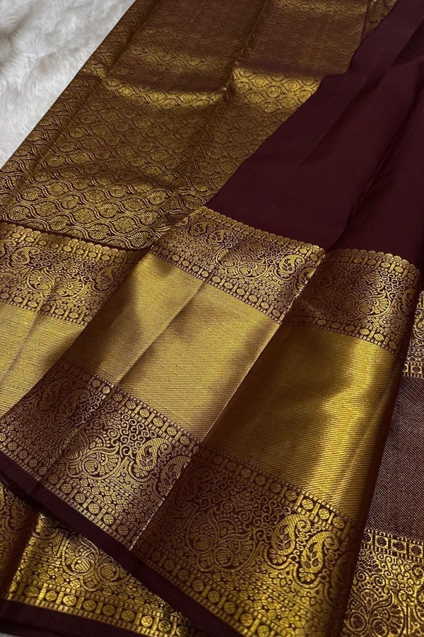 Dark Maroon Banarasi Soft Silk Saree with Sparse Zari Chakra Buttas and Grand Gold Border  in Surat