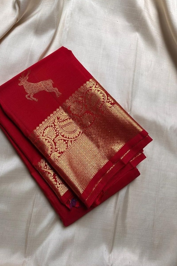 Deer Motif Banarasi Soft Silk Saree with Gold Zari Border in Black, Blue, Red and Wine  in Surat
