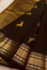 Deer Motif Banarasi Soft Silk Saree with Gold Zari Border in Black, Blue, Red and Wine  in Surat