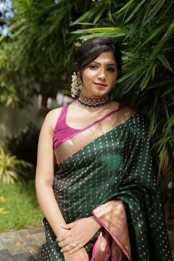 Emerald Green Banarasi Soft Silk Saree with Gold Zari Buttis and Peach Pink Woven Border  in Surat