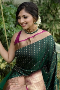 Emerald Green Banarasi Soft Silk Saree with Gold Zari Buttis and Peach Pink Woven Border  in Surat